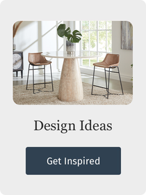Dining room with a round table and chairs, featuring the text 'Design Ideas Get Inspired'.