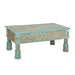 Hand-carved reclaimed wood coffee table with distressed turquoise finish and ogee lattice carved apron on turned baluster legs