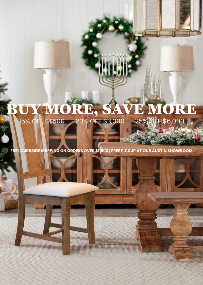 Dining room with wooden table, chairs, and festive wreath with lights. Ad text overlay: 'Buy More, Save More' with discount information. - World Interiors